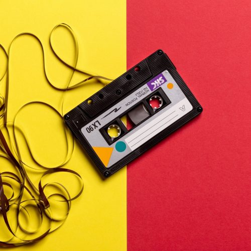 black-cassette-tape-on-top-of-red-and-yellow-surface-1626481 (2)